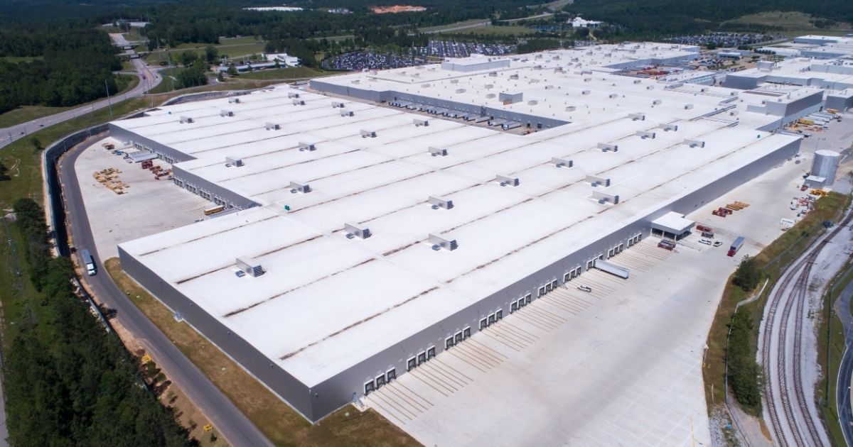 Completed industrial roofing project by The Rich Co Inc. on a large Colorado Springs facility