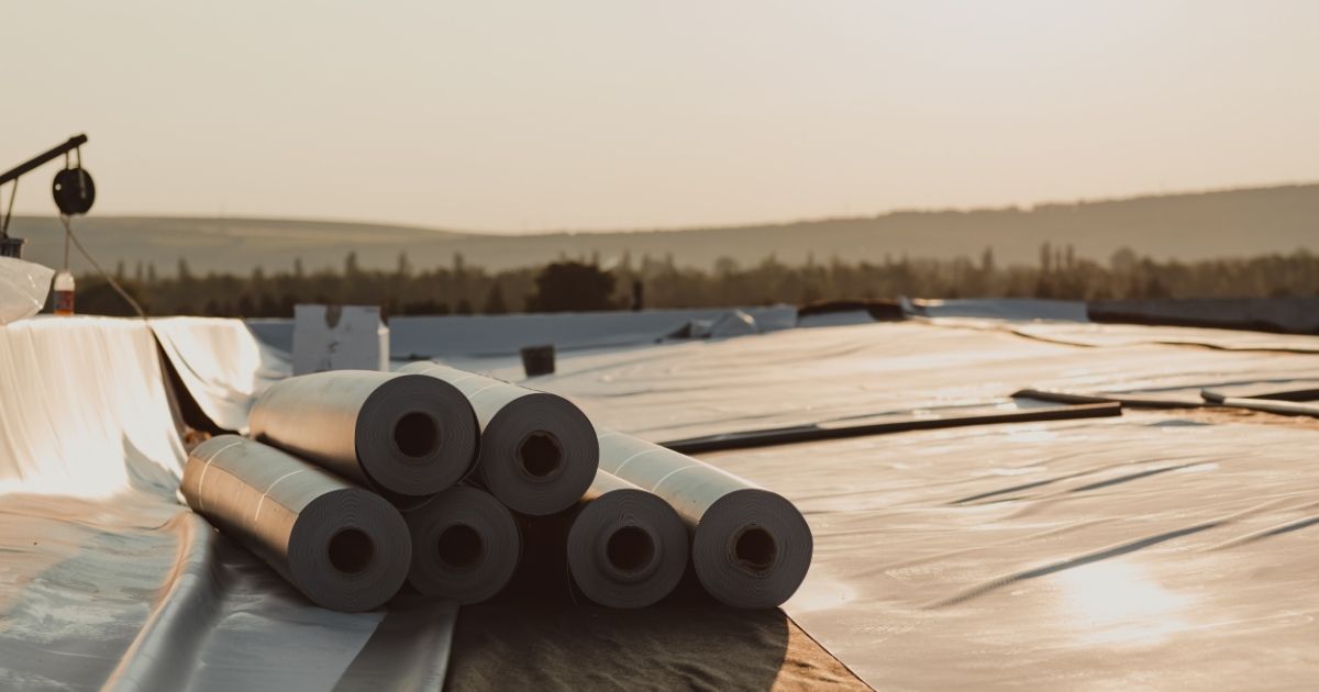 A completed single-ply PVC roof installed by The Rich Co Inc. on a Colorado Springs property