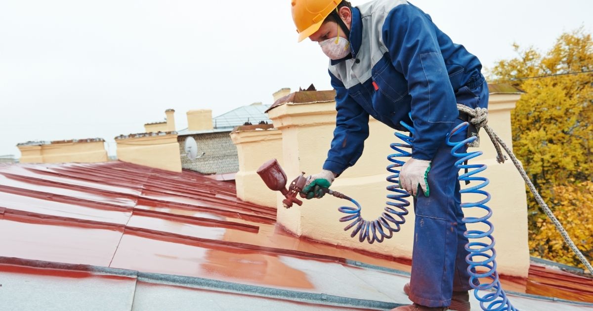 Freshly applied protective roof coating on a Colorado Springs commercial roof by The Rich Co Inc.