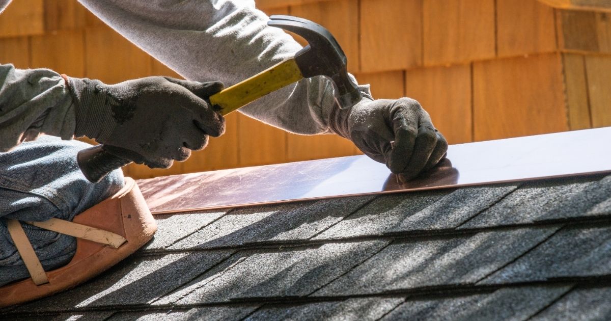 The Rich Co Inc. crew performing expert roof repair on a Colorado Springs home