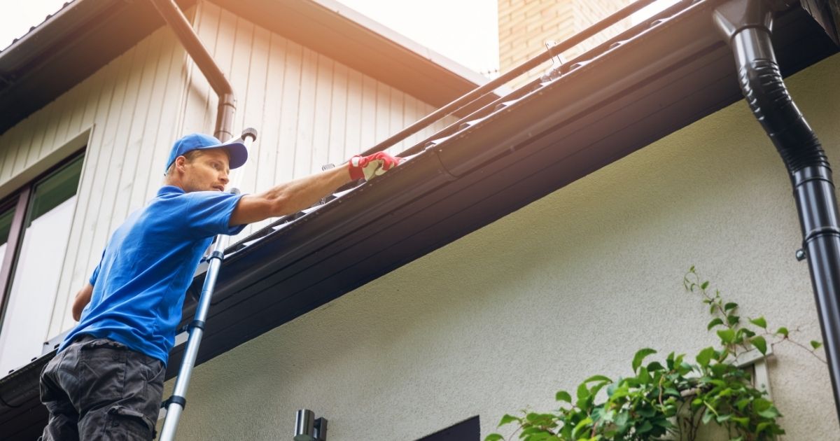 The Rich Co Inc. crew installing a new seamless gutter system on a Colorado Springs home