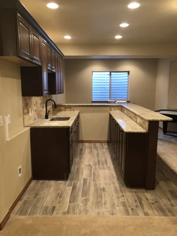 The Rich Co Inc. — basement wet bar kitchenette project in Colorado Springs